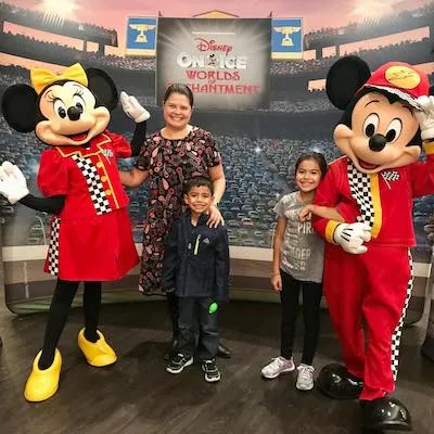 A publisher and her children with Minnie and Mickey Mouse at Disney On Ice